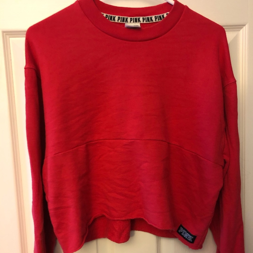 red sweatshirt with buttons on the sleeve :)